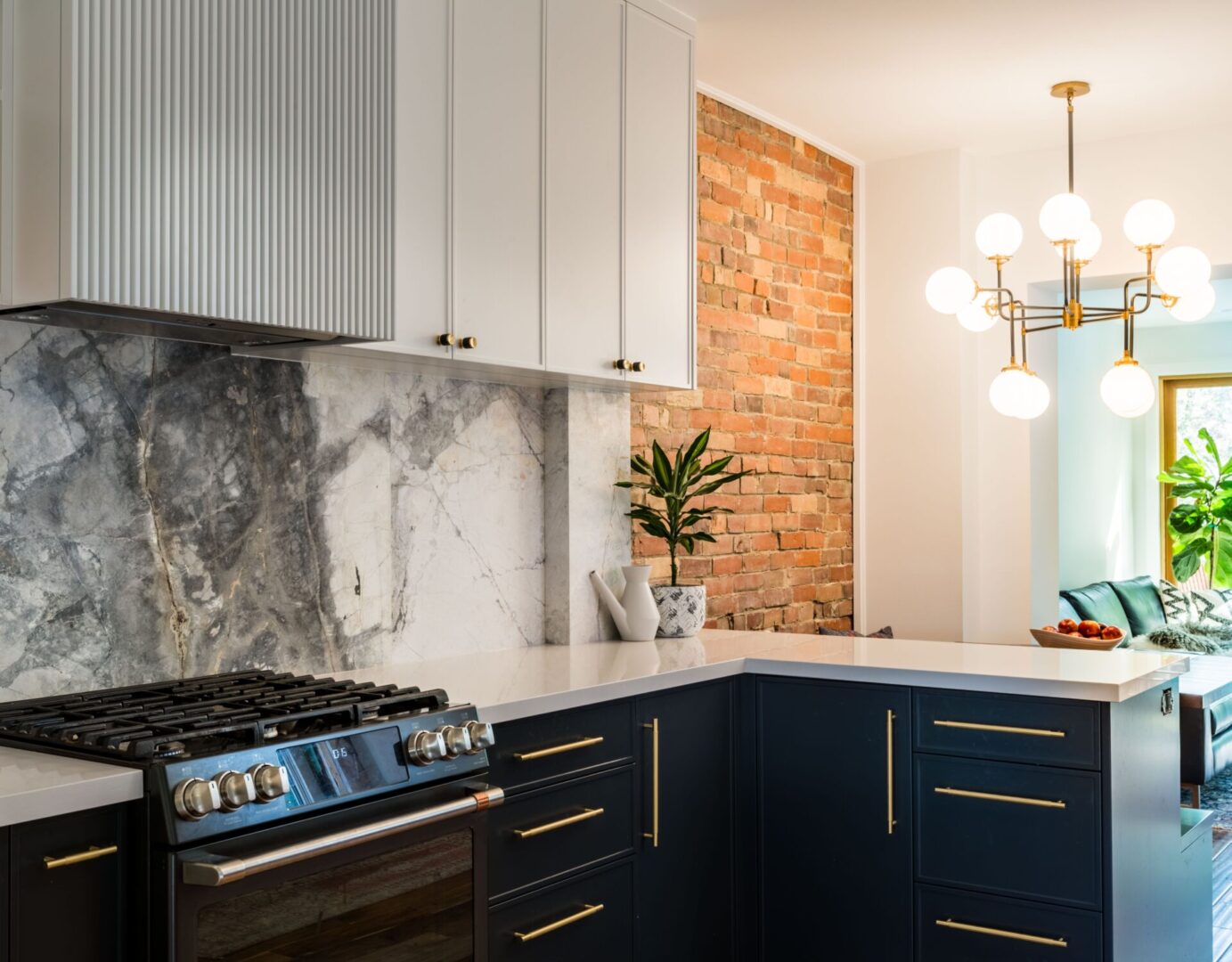 A kitchen with blue cabinets and white counters